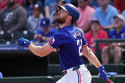 Mar 8, 2024; Surprise, Arizona, USA; Texas Rangers first baseman Jared Walsh (21) bats against the Kansas City Royals during the first inning at Surprise Stadium. Mandatory Credit: Joe Camporeale-USA TODAY Sports