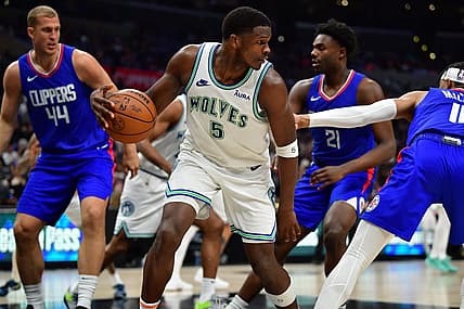 Mar 12, 2024; Los Angeles, California, USA; Minnesota Timberwolves guard Anthony Edwards (5) controls the ball against the Los Angeles Clippers during the second half at Crypto.com Arena. Mandatory Credit: Gary A. Vasquez-USA TODAY Sports