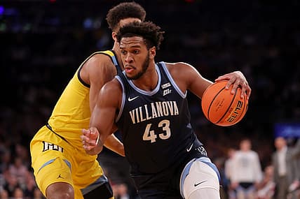 Mar 14, 2024; New York City, NY, USA; Villanova Wildcats forward Eric Dixon (43) drives to the basket against Marquette Golden Eagles forward Oso Ighodaro (13) during the first half at Madison Square Garden. Mandatory Credit: Brad Penner-USA TODAY Sports