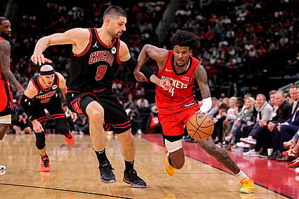 Mar 21, 2024; Houston, Texas, USA; Houston Rockets guard Jalen Green (4) handles the ball against Chicago Bulls center Nikola Vucevic (9) during the fourth quarter at Toyota Center. Mandatory Credit: Erik Williams-USA TODAY Sports