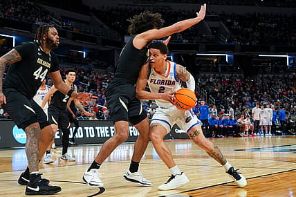 Florida Gators guard Riley Kugel (2) drives the lane against the Colorado Buffaloes on Friday, March 22, 2024, during the first round of the NCAA Men’s Basketball Tournament at Gainbridge Fieldhouse in Indianapolis. Florida Gators and Colorado Buffaloes are tied 45-45 at halftime.