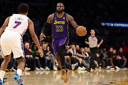 Mar 22, 2024; Los Angeles, California, USA;  Los Angeles Lakers forward LeBron James (23) dribbles the ball against Philadelphia 76ers guard Kyle Lowry (7) during the fourth quarter at Crypto.com Arena. Mandatory Credit: Kiyoshi Mio-USA TODAY Sports