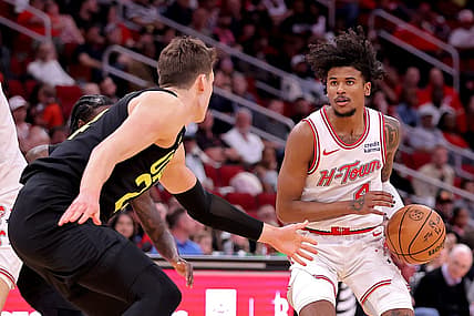 Mar 23, 2024; Houston, Texas, USA; Houston Rockets guard Jalen Green (4) handles the ball against Utah Jazz center Walker Kessler (24) during the third quarter at Toyota Center. Mandatory Credit: Erik Williams-USA TODAY Sports