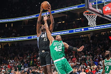 Mar 25, 2024; Atlanta, Georgia, USA; Atlanta Hawks center Clint Capela (15) grabs a rebound over Boston Celtics center Al Horford (42) in the second half at State Farm Arena. Mandatory Credit: Brett Davis-USA TODAY Sports