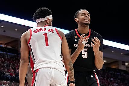 Mar 26, 2024; Columbus, OH, USA; Georgia Bulldogs center Frank Anselem-Ibe (5) reacts to a missed rebound beside Ohio State Buckeyes guard Roddy Gayle Jr. (1) during the first half of the NIT quarterfinals at Value City Arena.