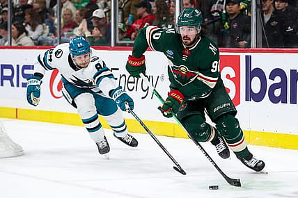 Mar 28, 2024; Saint Paul, Minnesota, USA; Minnesota Wild center Marcus Johansson (90) skates with the puck as San Jose Sharks defenseman Jan Rutta (84) defends during the second period at Xcel Energy Center. Mandatory Credit: Matt Krohn-USA TODAY Sports