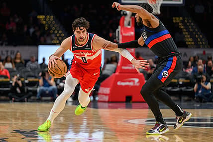 Mar 29, 2024; Washington, District of Columbia, USA; Washington Wizards forward Deni Avdija (8) drives to the basket against Detroit Pistons forward Troy Brown Jr. (7) at Capital One Arena. Mandatory Credit: Reggie Hildred-USA TODAY Sports
