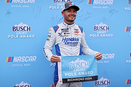 Mar 30, 2024; Richmond, Virginia, USA; NASCAR Cup Series driver Kyle Larson (5) celebrates within the pole after qualifying for the Toyota Owners 400 at Richmond Raceway. Mandatory Credit: Peter Casey-USA TODAY Sports