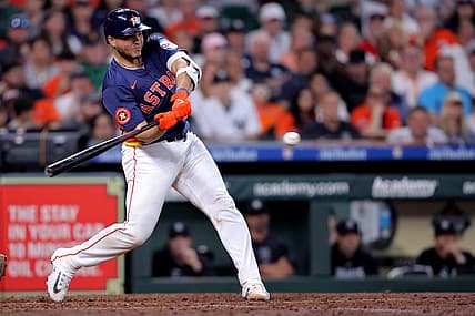 Mar 31, 2024; Houston, Texas, USA; Houston Astros designated hitter Yainer Diaz (21) hits an RBI single against the New York Yankees during the sixth inning at Minute Maid Park. Mandatory Credit: Erik Williams-USA TODAY Sports