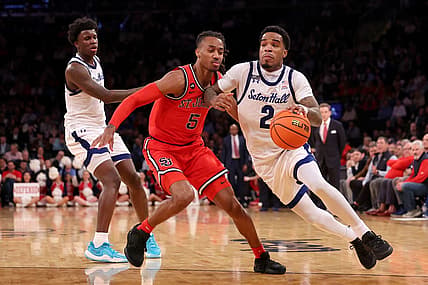 Mar 14, 2024; New York City, NY, USA; Seton Hall Pirates guard Al-Amir Dawes (2) drives to the basket against St. John's Red Storm guard Daniss Jenkins (5) during the second half at Madison Square Garden. Mandatory Credit: Brad Penner-USA TODAY Sports