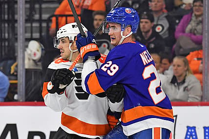 Apr 1, 2024; Philadelphia, Pennsylvania, USA; Philadelphia Flyers center Morgan Frost (48) and New York Islanders center Brock Nelson (29) battle for position during the second period at Wells Fargo Center. Mandatory Credit: Eric Hartline-USA TODAY Sports