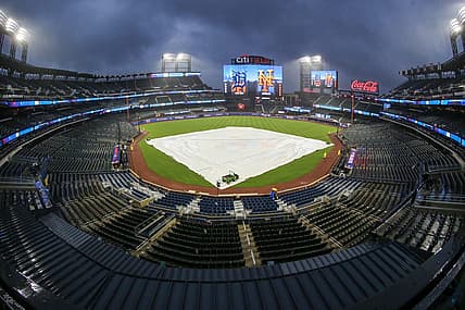 Apr 2, 2024; New York City, New York, USA;  The tarp is placed on the field during a rain delay prior to the game between the Detroit Tigers and the New York Mets at Citi Field. Mandatory Credit: Wendell Cruz-USA TODAY Sports