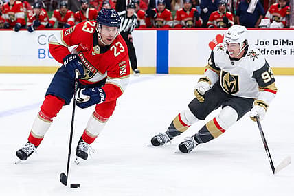 SUNRISE, FL - OCTOBER 25: Florida Panthers center Carter Verhaeghe (23) skates with the puck as Vegas Golden Knights right wing Mitch Marner (93) looks on in the second period during the game between the Golden Knights and the Florida Panthers on Saturday, October 25, 2025 at Amerant Bank Arena in Sunrise, FL.(Photo by Chris Arjoon/Icon Sportswire)