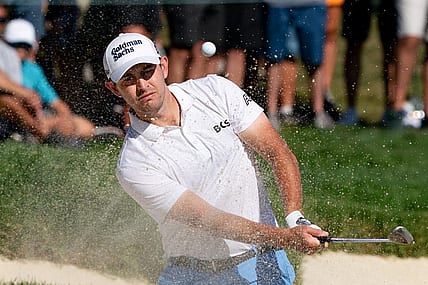 Aug 20, 2022; Wilmington, Delaware, USA; Patrick Cantlay plays a shot from a bunker on the 15th hole during the third round of the BMW Championship golf tournament. Mandatory Credit: Bill Streicher-USA TODAY Sports