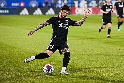 Apr 15, 2023; Montreal, Quebec, CAN;DC United forward Taxi Fountas (11) kicks the ball during the first half against D.C. United at Stade Saputo. Mandatory Credit: David Kirouac-USA TODAY Sports