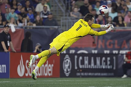 Jul 15, 2023; Foxborough, Massachusetts, USA; A header by New England Revolution forward Gustavo Bou (7) gets past D.C. United goalkeeper Tyler Miller (1) for a goal during the first half at Gillette Stadium. Mandatory Credit: Winslow Townson-USA TODAY Sports