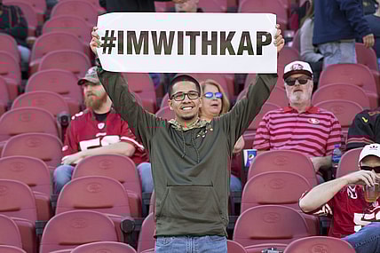 Fans show support for Colin Kaepernick's national anthem protests.