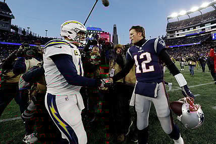 Tom Brady and Philip Rivers shake hands after NFL Playoff game.