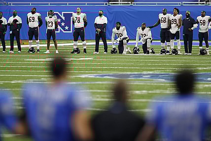 Chicago Bears and Detroit Lions players demonstrate in Week 1