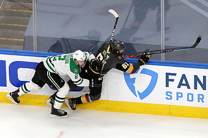 Sep 14, 2020; Edmonton, Alberta, CAN; Dallas Stars defenseman Jamie Oleksiak (2) checks Vegas Golden Knights right wing Mark Stone (61) during the second period in game five of the second round of the 2020 Stanley Cup Playoffs at Rogers Place. Mandatory Credit: Gerry Thomas-USA TODAY Sports