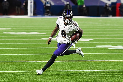 Jan 16, 2021; Orchard Park, New York, USA; Baltimore Ravens quarterback Lamar Jackson (8) runs with the ball against the Buffalo Bills during the third quarter of an AFC Divisional Round game at Bills Stadium. Mandatory Credit: Rich Barnes-USA TODAY Sports