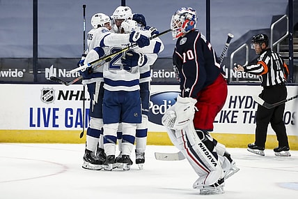 Jan 21, 2021; Columbus, Ohio, USA; Tampa Bay Lightning center Brayden Point (21) celebrates with teammates after scoring the game-winning goal against the Columbus Blue Jackets in the overtime period at Nationwide Arena. Mandatory Credit: Aaron Doster-USA TODAY Sports