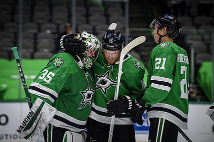 Jan 22, 2021; Dallas, Texas, USA; Dallas Stars goaltender Anton Khudobin (35) and center Joe Pavelski (16) and left wing Jason Robertson (21) celebrate the win over the Nashville Predators at the American Airlines Center. Mandatory Credit: Jerome Miron-USA TODAY Sports