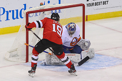 Jan 24, 2021; Newark, New Jersey, USA; New York Islanders goaltender Ilya Sorokin (30) makes a save on New Jersey Devils center Travis Zajac (19) during the first period at Prudential Center. Mandatory Credit: Ed Mulholland-USA TODAY Sports