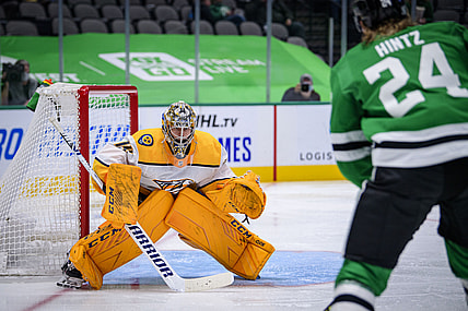 Jan 24, 2021; Dallas, Texas, USA; Nashville Predators goaltender Juuse Saros (74) faces a shot by Dallas Stars left wing Roope Hintz (24) during the second period at the American Airlines Center. Mandatory Credit: Jerome Miron-USA TODAY Sports