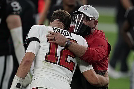 Oct 25, 2020; Paradise, Nevada, USA; Tampa Bay Buccaneers quarterback Tom Brady (12) and coach Bruce Arians embrace after the game against the Las Vegas Raiders at Allegiant Stadium. The Buccaneers defeated the Raiders 45-20. Mandatory Credit: Kirby Lee-USA TODAY Sports