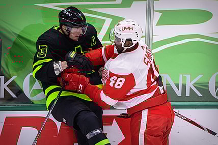 Jan 28, 2021; Dallas, Texas, USA; Detroit Red Wings right wing Givani Smith (48) checks Dallas Stars defenseman John Klingberg (3) during the first period at the American Airlines Center. Mandatory Credit: Jerome Miron-USA TODAY Sports