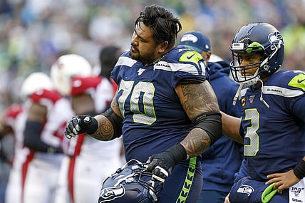 Dec 22, 2019; Seattle, Washington, USA; Seattle Seahawks offensive guard Mike Iupati (70) walks off the field with quarterback Russell Wilson (3) following a first quarter injury against the Arizona Cardinals at CenturyLink Field. Mandatory Credit: Joe Nicholson-USA TODAY Sports