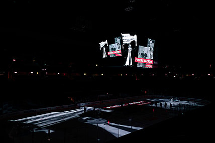 Jan 13, 2021; Denver, Colorado, USA; Former Colorado Avalanche president and general manager Pierre Lacroix is honored on the scoreboard before the game against the St. Louis Blues at Ball Arena. Lacroix died on December 13, 2020 due to complications from COVID-19. Mandatory Credit: Isaiah J. Downing-USA TODAY Sports