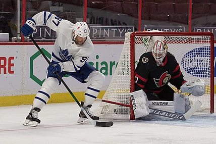 Jan 16, 2021; Ottawa, Ontario, CAN; Toronto Maple Leafs center Joe Thornton (97) moves the puck in front of Ottawa Senators goalie Matt Murray (30) in the first period at the Canadian Tire Centre. Mandatory Credit: Marc DesRosiers-USA TODAY Sports