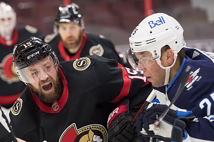 Jan 19, 2021; Ottawa, Ontario, CAN; Ottawa Senators center Derek Stepan (15) faces off against Winnipeg Jets center Paul Stastny (25) in the first period at the Canadian Tire Centre. Mandatory Credit: Marc DesRosiers-USA TODAY Sports