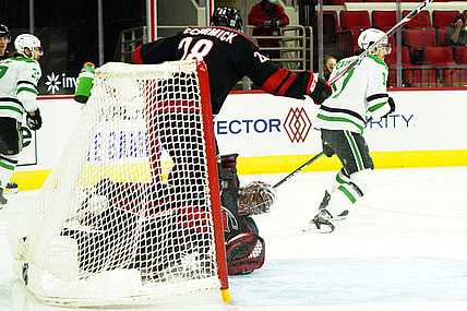 Jan 30, 2021; Raleigh, North Carolina, USA;  Carolina Hurricanes goaltender Petr Mrazek (34) is hurt on a collision with Carolina Hurricanes left wing Max McCormick (28) during the first period at PNC Arena. Mandatory Credit: James Guillory-USA TODAY Sports
