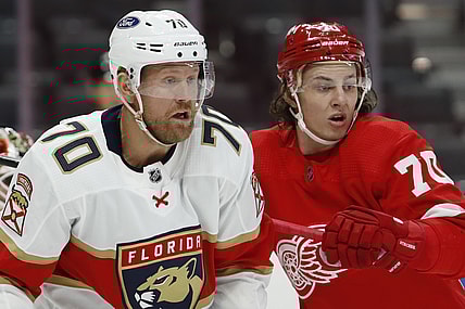 Jan 31, 2021; Detroit, Michigan, USA; Florida Panthers right wing Patric Hornqvist (left) fights for position in front of the net against Detroit Red Wings defenseman Troy Stecher (right) during the third period at Little Caesars Arena. Mandatory Credit: Raj Mehta-USA TODAY Sports