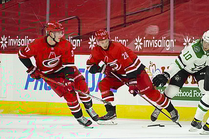 Jan 31, 2021; Raleigh, North Carolina, USA;  Carolina Hurricanes right wing Sebastian Aho (20) and right wing Andrei Svechnikov (37) skate with the puck against the Dallas Stars at PNC Arena. Mandatory Credit: James Guillory-USA TODAY Sports