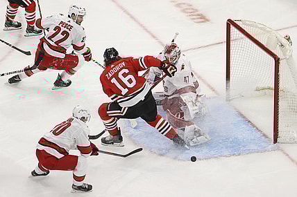 Feb 2, 2021; Chicago, Illinois, USA; Carolina Hurricanes goaltender James Reimer (47) defends against Chicago Blackhawks defenseman Nikita Zadorov (16) during the second period at United Center. Mandatory Credit: Kamil Krzaczynski-USA TODAY Sports