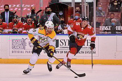 Feb 5, 2021; Sunrise, Florida, USA; Nashville Predators defenseman Roman Josi (59) skates with the puck past Florida Panthers center Noel Acciari (55) during the first period at BB&T Center. Mandatory Credit: Jasen Vinlove-USA TODAY Sports