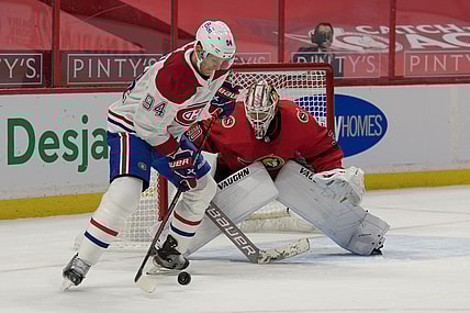 Feb 6, 2021; Ottawa, Ontario, CAN; Montreal Canadiens right wing Corey Perry (94) skates with the puck in front of  Ottawa Senators goalie Matt Murray (30) in the first period at the Canadian Tire Centre. Mandatory Credit: Marc DesRosiers-USA TODAY Sports