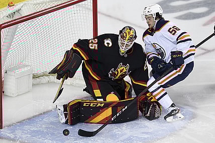 Feb 6, 2021; Calgary, Alberta, CAN; Calgary Flames goalie Jacob Markstrom (25) stops a shot from Edmonton Oilers forward Kailer Yamamoto (56) during the second period at Scotiabank Saddledome. Mandatory Credit: Candice Ward-USA TODAY Sports