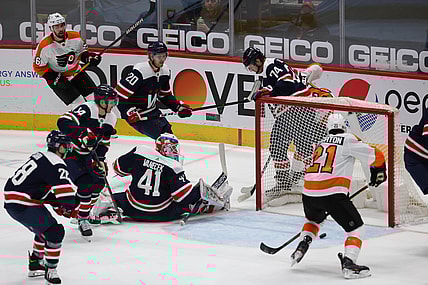 Feb 7, 2021; Washington, District of Columbia, USA; Philadelphia Flyers center Scott Laughton (21) scores a goal on Washington Capitals goaltender Vitek Vanecek (41) in the first period at Capital One Arena. Mandatory Credit: Geoff Burke-USA TODAY Sports