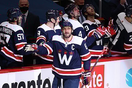 Feb 7, 2021; Washington, District of Columbia, USA; Washington Capitals left wing Alex Ovechkin (8) celebrates with teammates after scoring a goal against the Philadelphia Flyers in the second period at Capital One Arena. Mandatory Credit: Geoff Burke-USA TODAY Sports