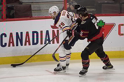 Feb 8, 2021; Ottawa, Ontario, CAN; Edmonton Oilers center Leon Draisaitl (29) skates with the puck in front of  Ottawa Senators defenseman Mike Reilly (5) in the third period at the Canadian Tire Centre. Mandatory Credit: Marc DesRosiers-USA TODAY Sports