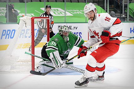Feb 11, 2021; Dallas, Texas, USA; Dallas Stars goaltender Anton Khudobin (35) defends the goal against Carolina Hurricanes center Vincent Trocheck (16) during the first period at the American Airlines Center. Mandatory Credit: Jerome Miron-USA TODAY Sports