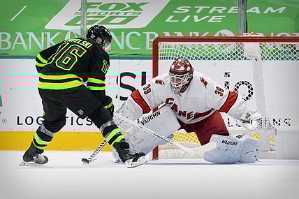 Feb 13, 2021; Dallas, Texas, USA; Carolina Hurricanes goaltender Alex Nedeljkovic (39) stops a shot by Dallas Stars center Joe Pavelski (16) during the overtime shootout at the American Airlines Center. Mandatory Credit: Jerome Miron-USA TODAY Sports