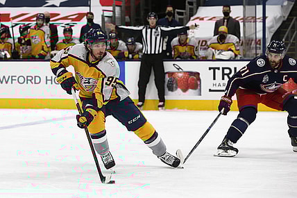 Feb 18, 2021; Columbus, Ohio, USA; Nashville Predators center Matt Duchene (95) carries the puck as Columbus Blue Jackets left wing Nick Foligno (71) defends during the second period at Nationwide Arena. Mandatory Credit: Russell LaBounty-USA TODAY Sports