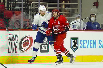 Feb 20, 2021; Raleigh, North Carolina, USA;  Carolina Hurricanes left wing Jordan Martinook (48) checks Tampa Bay Lightning defenseman Erik Cernak (81) during the first period at PNC Arena. Mandatory Credit: James Guillory-USA TODAY Sports