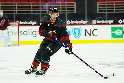 Feb 17, 2021; Raleigh, North Carolina, USA;  Carolina Hurricanes center Jordan Staal (11) skates with the puck against the Florida Panthers at PNC Arena. Mandatory Credit: James Guillory-USA TODAY Sports